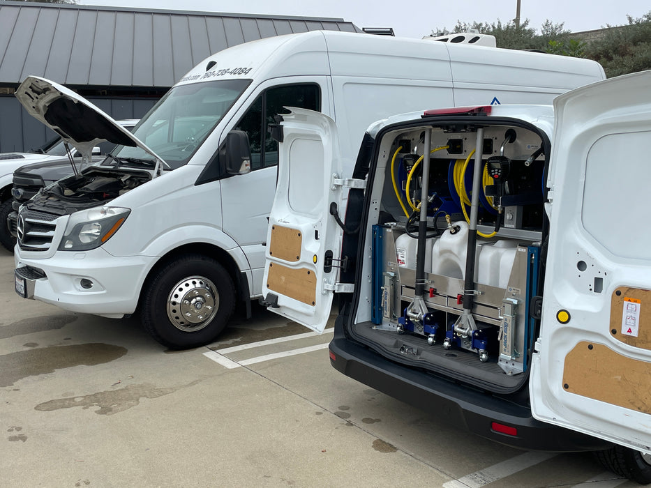 The AGA Compact Mobile Van Oil System has an electronic oil dispensing handle with manual and preset settings. It includes a 50' new oil hose reel, a 50' hose reel for the remote pump, and a 50' air hose reel. The system has a remote pump, drain tool, and two jack rod stands with mounts. Furthermore, it provides ample space to accommodate two floor jacks.